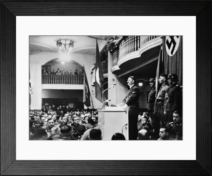 Framed Print : Adolf Hitler giving his annual speech to his old guard at the Munich beer hall, Nov. 8, 1939. Minutes after Hitler left, a bomb planted in the lectern exploded. Nov