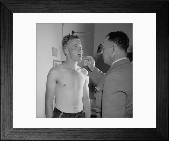 Framed Print : New recruit to the U.S. Army during his physical exam. 21 year old from West Virginia is examined by army doctor, Ca. 1940. (BSLOC_2013_9_220)
