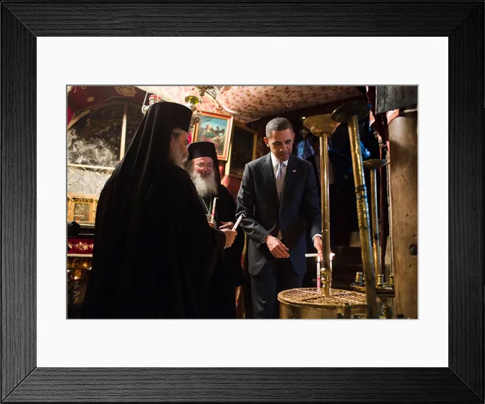 Framed Print : President Barack Obama visits the Church of the Nativity in Bethlehem, the West Bank, Palestine. He lights candles with Greek Orthodox priests. (BSLOC_2015_3_193)