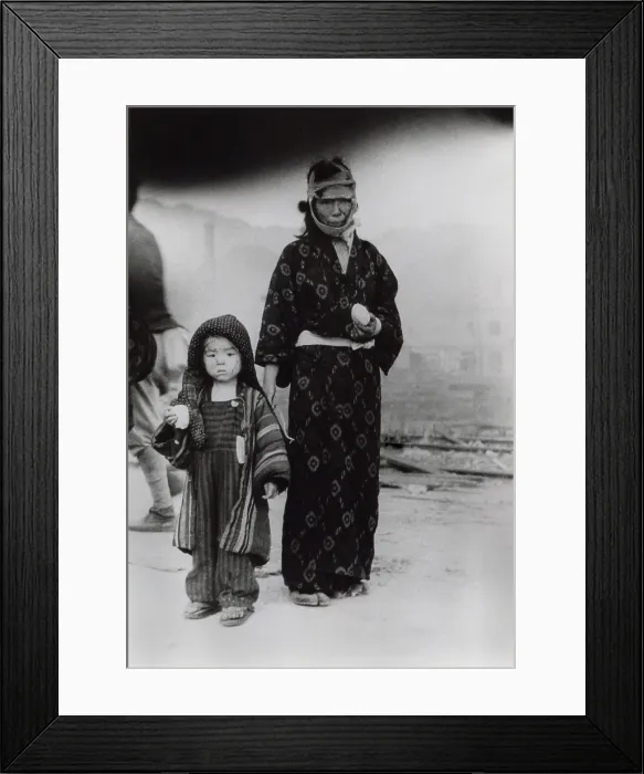 Framed Print : Nagasaki atomic bomb survivors holding boiled rice balls distributed by emergency workers
