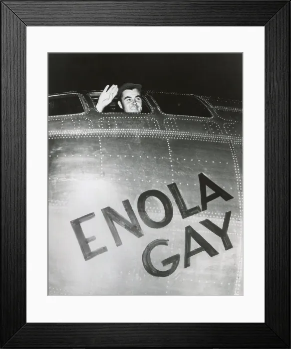 Framed Print : Col. Paul W. Tibbets, Jr. pilot of the ENOLA GAY waves from his cockpit before the takeoff. Several hours later, the B-29 bomber dropped the first atomic bomb on Hiroshima Framed Print : Col. Paul W. Tibbets, Jr. pilot of the ENOLA GAY waves from his cockpit before the takeoff. Several hours later, the B-29 bomber dropped the first atomic bomb on Hiroshima