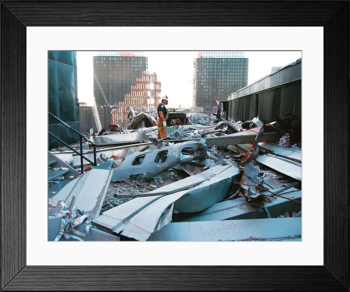 Framed Print : A portion of the fuselage of United Airlines Flight 175 on the roof of WTC 5, Oct. 25, 2001. This was from the plane that crashed into the South Tower, WTC 2