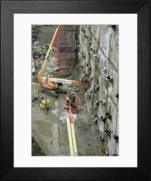 Framed Print : Personnel at Ground Zero tie back and reinforce the exposed slurry wall on March 15, 2002