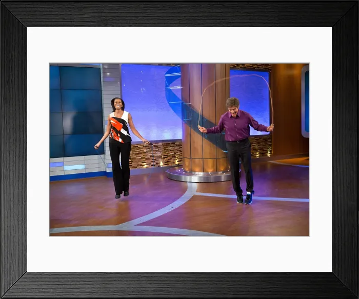 Framed Print : First Lady Michelle Obama and Dr. Mehmet Oz jump during a taping of the Dr. Oz Show'. First Lady's discussed improvements to federal guidelines for school lunches Framed Print : First Lady Michelle Obama and Dr. Mehmet Oz jump during a taping of the Dr. Oz Show'. First Lady's discussed improvements to federal guidelines for school lunches