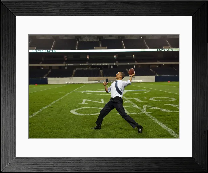 Framed Print : President Barack Obama throws a football at Soldier Field. Chicago, Illinois, May 20, 2012. (BSLOC_2015_3_12)