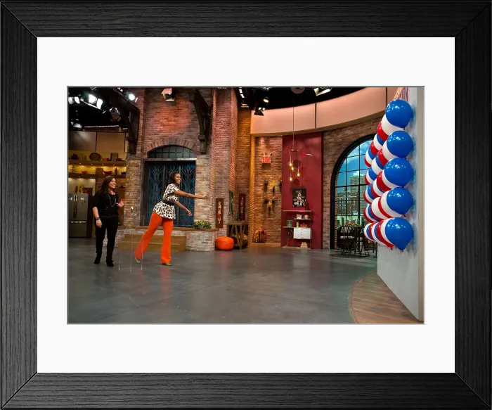 Framed Print : First Lady Michelle Obama during a taping of the Rachael Ray Show on Aug. 29, 2012. Mrs
