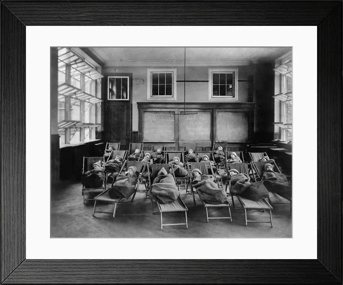 Framed Print : Children in the Fresh Air Class at PS 51, Manhattan, NYC, March 20, 1911. Children are wrapped in blankets and warm knit hats during a nap with the window wide open Framed Print : Children in the Fresh Air Class at PS 51, Manhattan, NYC, March 20, 1911. Children are wrapped in blankets and warm knit hats during a nap with the window wide open