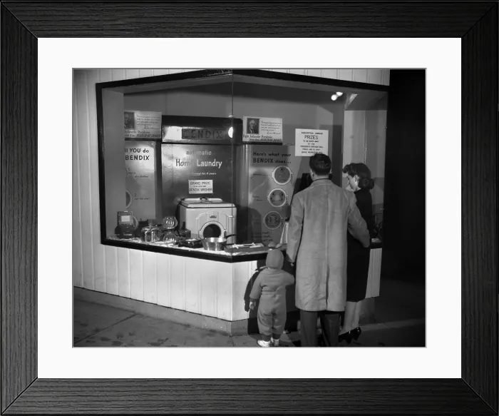 Framed Print : Young family look at the Bendix Automatic Home Laundry. It will be given away by the Elks Club at the President's Birthday Ball for March of Dimes. Oak Ridge, Tennessee Framed Print : Young family look at the Bendix Automatic Home Laundry. It will be given away by the Elks Club at the President's Birthday Ball for March of Dimes. Oak Ridge, Tennessee