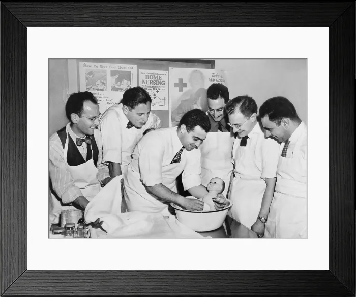 Framed Print : Expectant fathers bathing a doll during an infant care class at the Brooklyn Red Cross Headquarters. 1947. (BSLOC_2014_13_155)