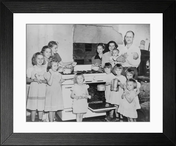 Framed Print : Mr. and Mrs. Lloyd Brooks of Pittsfield, Maine, and their 12 daughters. They live on his salary as a woolen mill worker, by eating potatoes, vegetables, cereal and milk