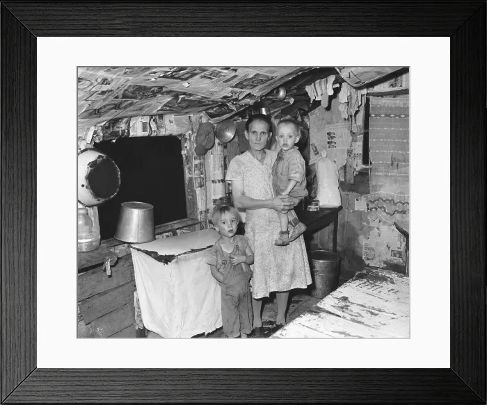 Framed Print : Miner's wife with two children in a 3 room house that rents for $6 monthly. There is no electricity or running water