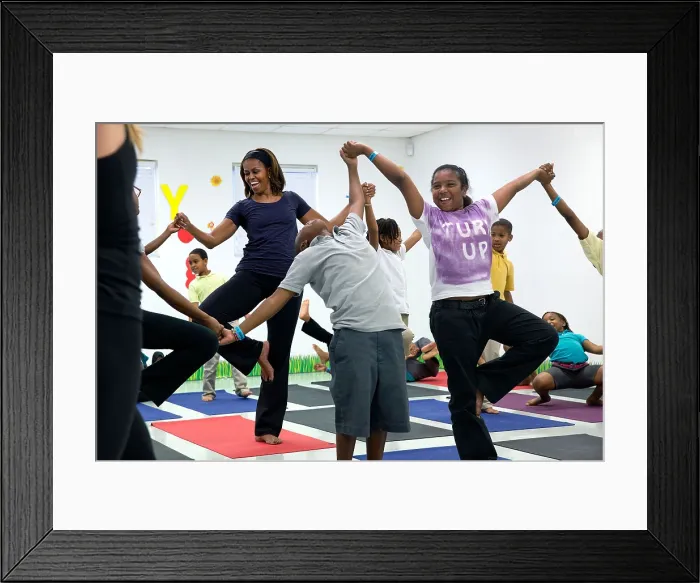 Framed Print : First Lady Michelle Obama joins an after school Let's Move! yoga class after school activities. Gwen Cherry Park, Miami, Florida, Feb. 25, 2014. (BSLOC_2015_13_178)