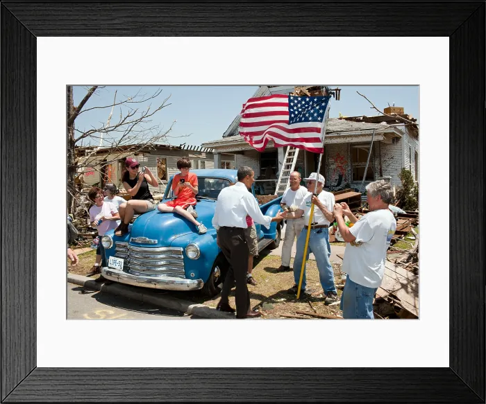 Framed Print : President Barack Obama greets Hugh Hills, 85, in front of his home in Joplin, Mo. May 29, 2011
