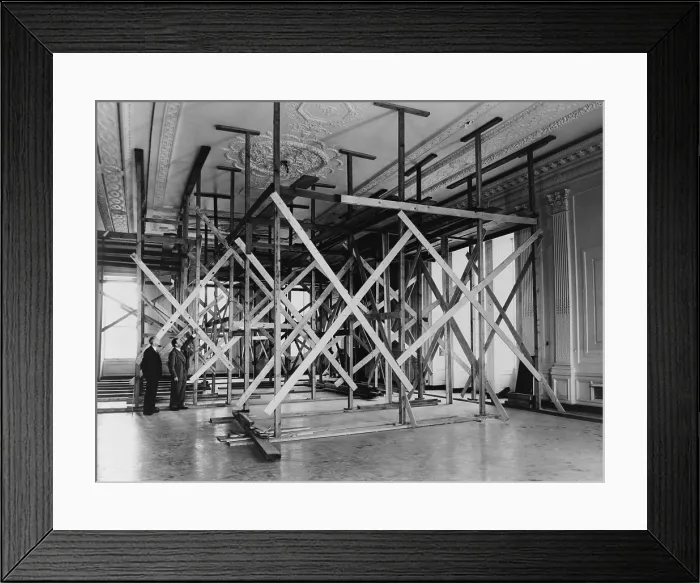 Framed Print : White House architect Lorenzo Winslow and engineer C.W. Barber in the White House East Room. They inspect the sagging ceiling supported by scaffolding. - (BSLOC_2014_15_118)