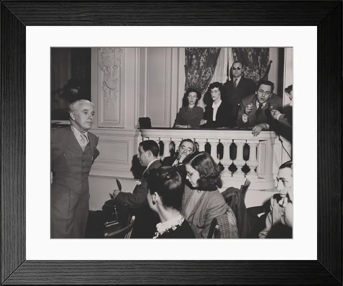 Framed Print : Charlie Chaplin during a press conference in the Hotel Gotham, New York City, April 14, 1947