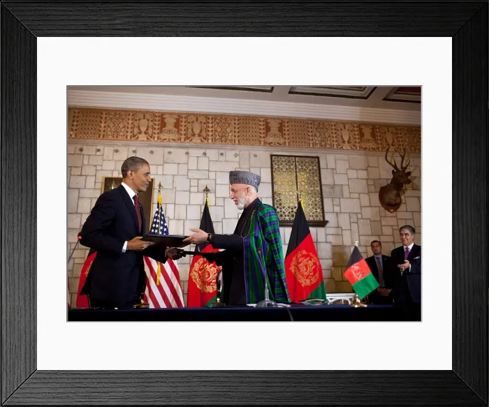Framed Print : Barack Obama and Hamid Karzai exchange documents after signing the strategic partnership agreement. Presidential Palace in Kabul, Afghanistan, May 1, 2012. (BSLOC_2015_3_140)