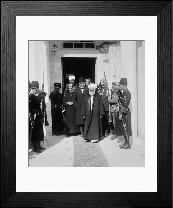 Framed Print : Hussein bin Ali, Sharif of Mecca, leads a group from a doorway, in Amman, Trans-Jordan, 1921 Framed Print : Hussein bin Ali, Sharif of Mecca, leads a group from a doorway, in Amman, Trans-Jordan, 1921
