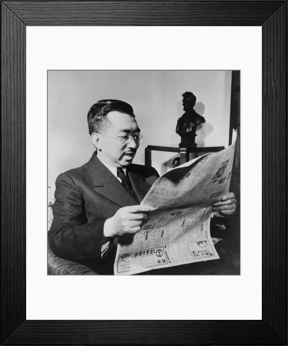 Framed Print : Emperor Hirohito happily reads about the signing of a peace treaty between the U.S. and Japan. The Treaty marked the end of U.S. Occupation of Japan
