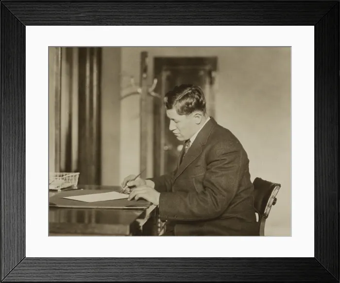 Framed Print : Jim Thorpe, Gold Medalist of the 1912 Olympics, signing a sheet of paper in early 1913