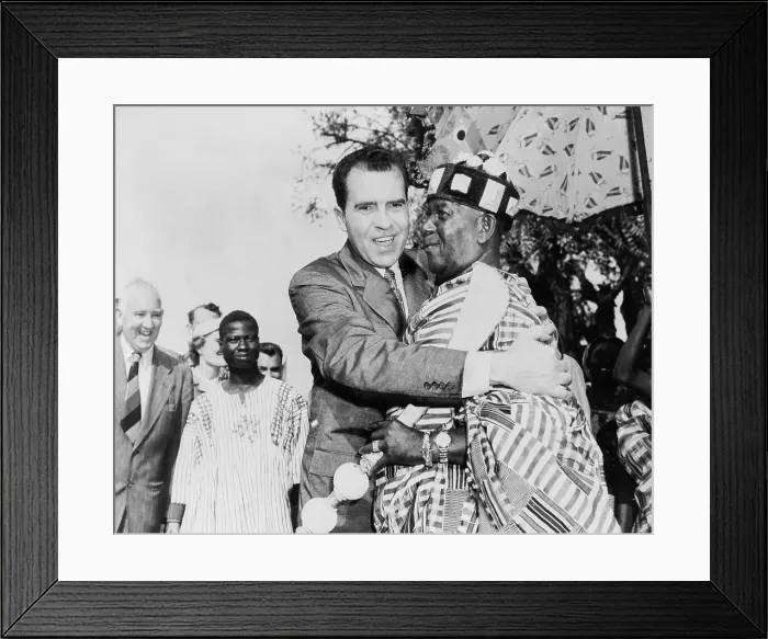 Framed Print : Vice President Nixon embraces Chief Osae Dyan II, head of the Osu Alata tribe, on campus of Accra University. Nixon was attending Ghana's independence ceremonies