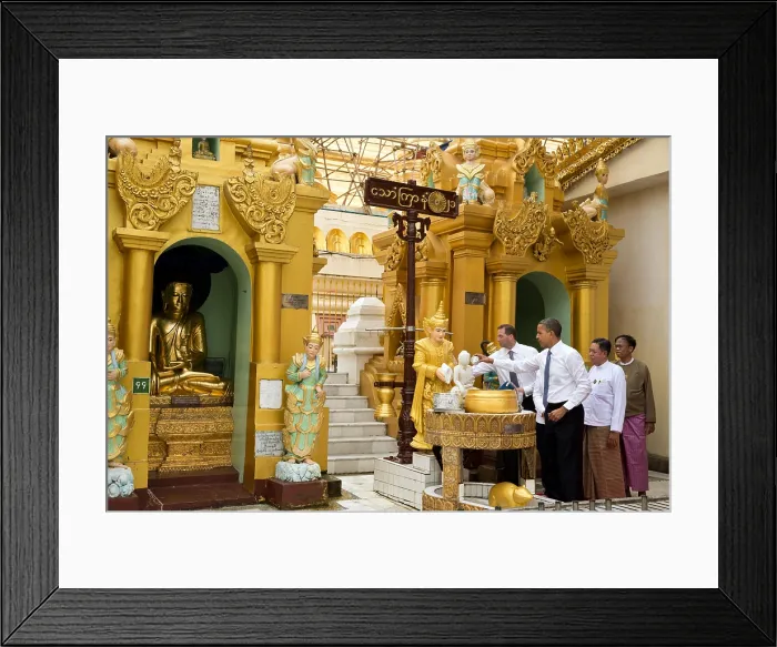 Framed Print : President Barack Obama pours water over the left shoulder of the Friday Buddha. He was touring the Shwedagon Pagoda in Yangon, Myanmar (Rangoon, Burma), Nov. 19, 2012