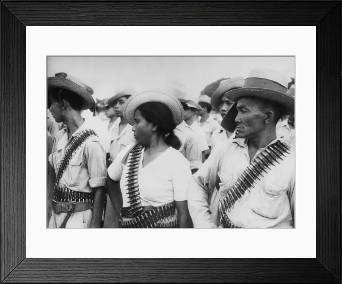 Framed Print : Indonesian peasant guerrillas wearing bandoliers. They are part of the non-uniformed combat personnel trained to support regular Indonesian military forces