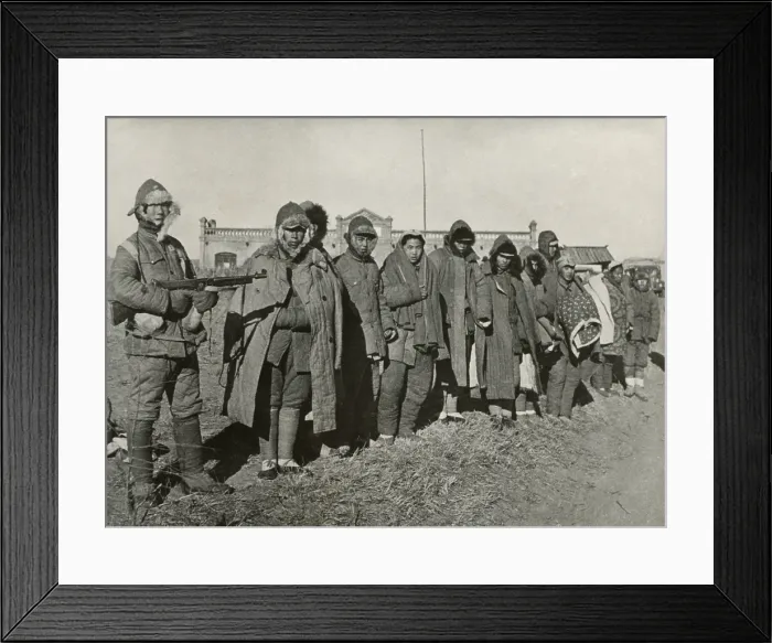 Framed Print : Chinese Civil War 1946-1949. Troops of the 38E Division of Nationalists Chinese Army in Manchuria guard Communist prisoners. Jan. 9, 1947. - (BSLOC_2014_15_167)