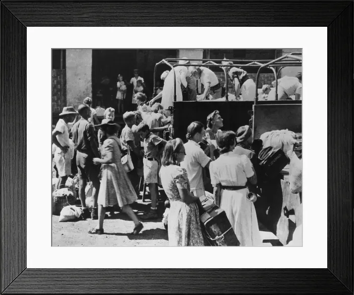 Framed Print : Dutch civilians after their release from an Indonesian Nationalist internment camp. They are loading their belongings into trucks after they had been rescued by British troops Framed Print : Dutch civilians after their release from an Indonesian Nationalist internment camp. They are loading their belongings into trucks after they had been rescued by British troops