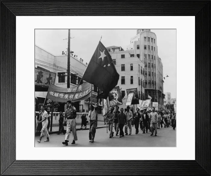 Framed Print : Communist marchers parade along the Pearl River waterfront in Canton (Guangzhou), China. They carry signs with portraits of Stalin and Chinese Communist leaders. 1949