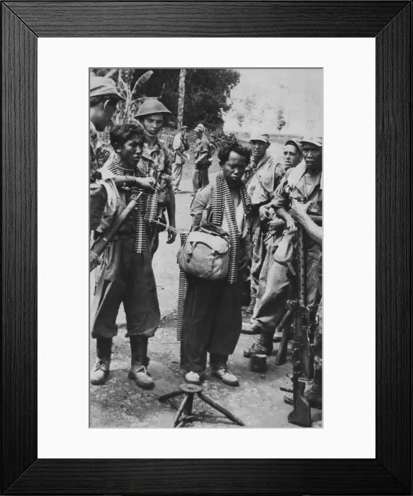 Framed Print : Two captured Indonesian army soldiers, with bandoliers around their necks, 1947