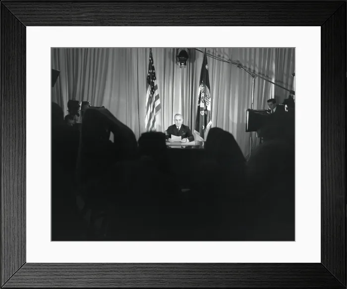 Framed Print : President Harry Truman seated at his desk with lights on and cameras rolling. He was announcing that World War 2 in Europe had ended. May 9, 1845. - (BSLOC_2014_15_18)