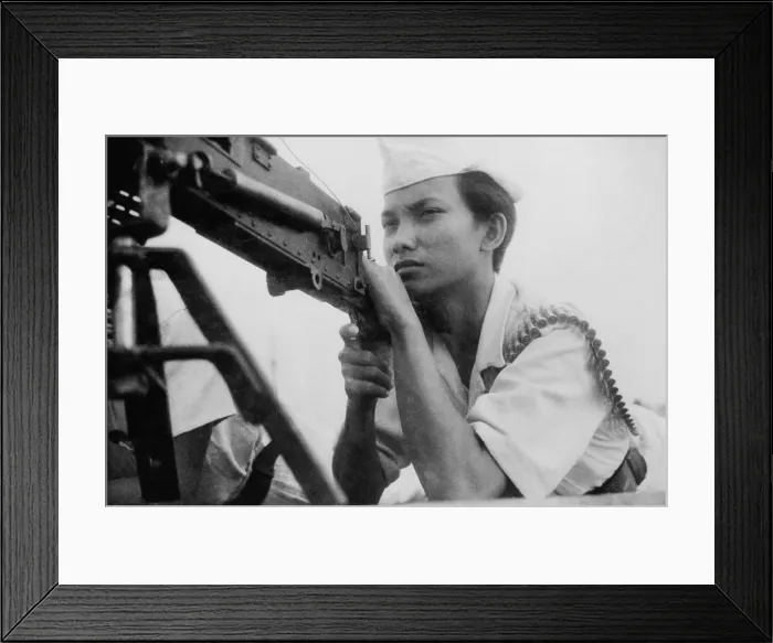 Framed Print : Indonesian female militia member manning a machine gun. 1946. - (BSLOC_2014_15_180)