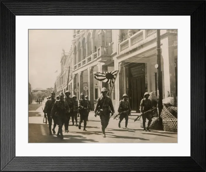 Framed Print : Japanese troops march in the streets of Hainan Island with a Rising Sun flag. May 3, 1939