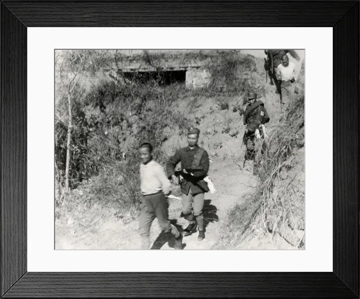 Framed Print : Chinese Communist soldiers are taken from a tower captured by government forces. The fighting took place along the border of Kiangsi and Fukien provinces in January 1934