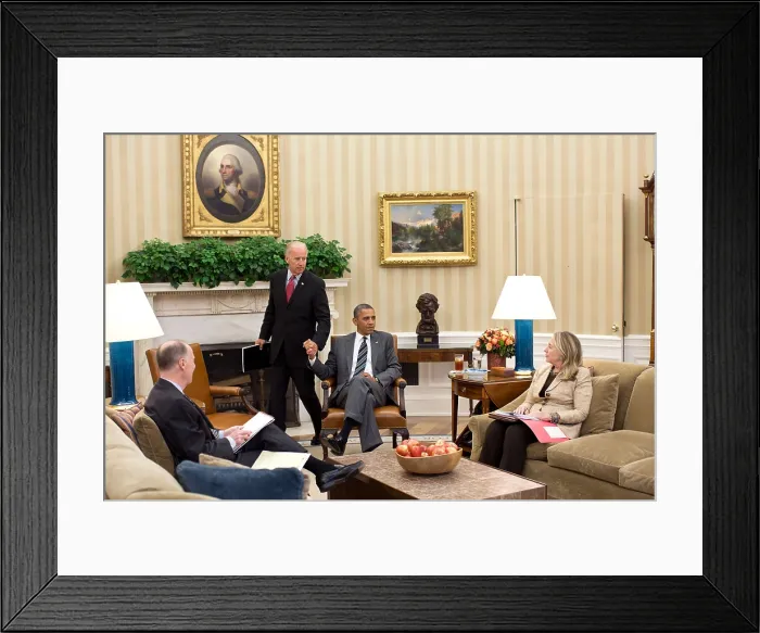 Framed Print : VP Joe Biden and Pres. Obama grip hands as he arrives for a meeting in the Oval Office. Already seated are Sec Framed Print : VP Joe Biden and Pres. Obama grip hands as he arrives for a meeting in the Oval Office. Already seated are Sec