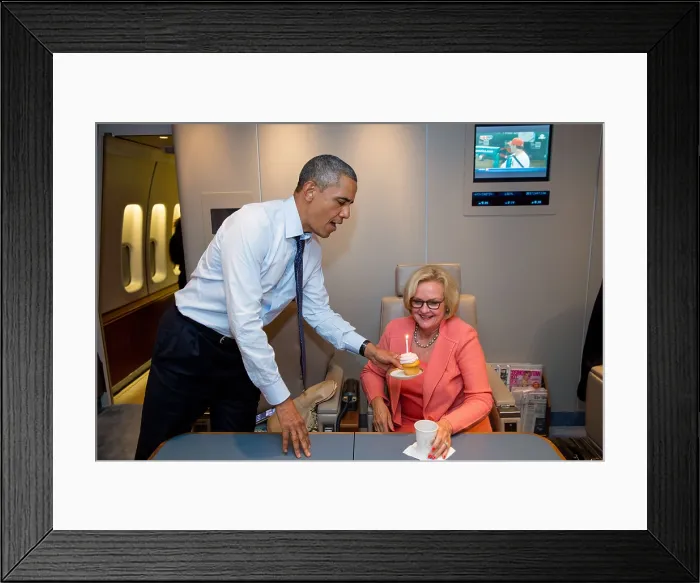 Framed Print : President Obama presents Sen. Claire McCaskill, with a birthday cupcake aboard Air Force One. July 24, 2013. (BSLOC_2015_13_230)