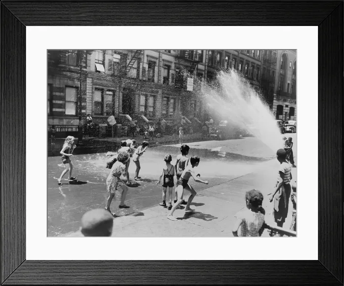Framed Print : Children escape the heat of the East Side by opening a fire hydrant. New York City, June 1943. (BSLOC_2014_13_166)