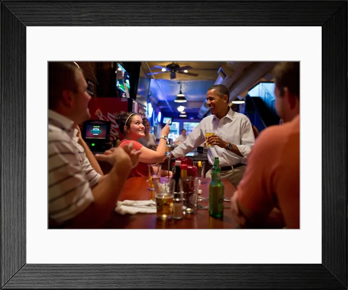 Framed Print : President Barack Obama has a beer with patrons at the Pump Haus Pub and Grill in Waterloo, Iowa. Aug. 14, 2012. (BSLOC_2015_13_153)