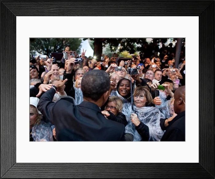 Framed Print : President Obama greets people following a ceremony to honor the French and American Alliance. The French waited in the rain at the World War I Memorial in Cannes, France, Nov Framed Print : President Obama greets people following a ceremony to honor the French and American Alliance. The French waited in the rain at the World War I Memorial in Cannes, France, Nov