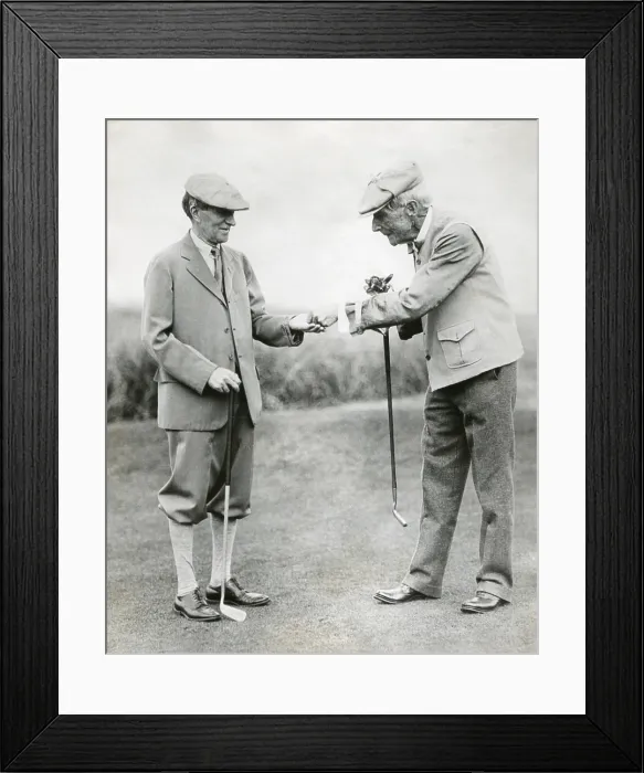 Framed Print : A splendid long putt deserves a dime'. John D. Rockefeller hands Harvey Firestone a dime during a golf match at Orvond Beach, Florida. Jan. 31, 1930. - (BSLOC_2014_14_2) Framed Print : A splendid long putt deserves a dime'. John D. Rockefeller hands Harvey Firestone a dime during a golf match at Orvond Beach, Florida. Jan. 31, 1930. - (BSLOC_2014_14_2)