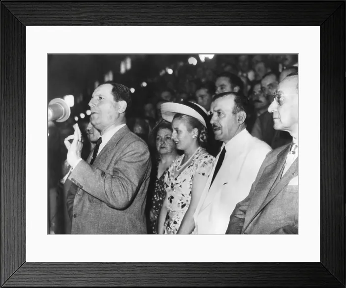 Framed Print : Argentine President Juan Domingo Peron addressing an assembly in Buenos Aires. Behind him (in straw hat), is his wife, Senora Maria Eva Duarte de Peron. Ca. 1946-1950