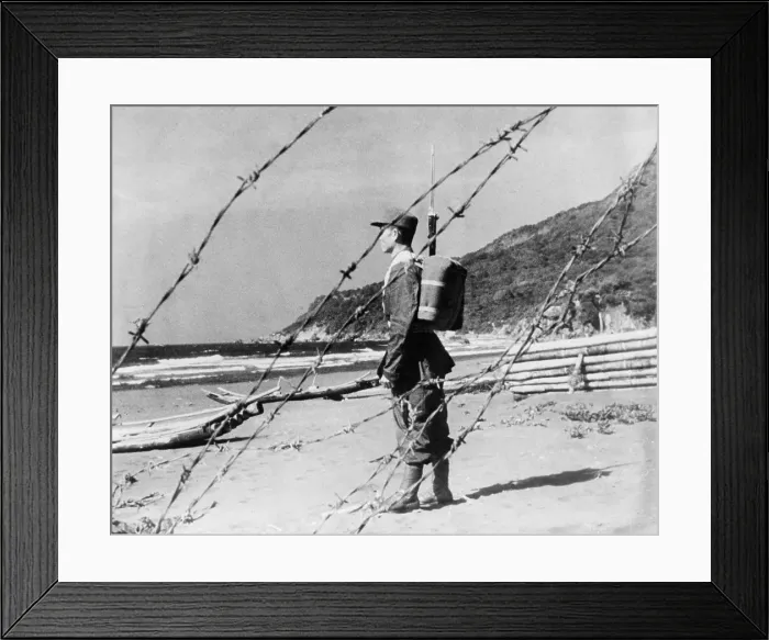 Framed Print : Chinese Nationalist soldier stands guard on a sandy beach somewhere along Formosa's coast Framed Print : Chinese Nationalist soldier stands guard on a sandy beach somewhere along Formosa's coast