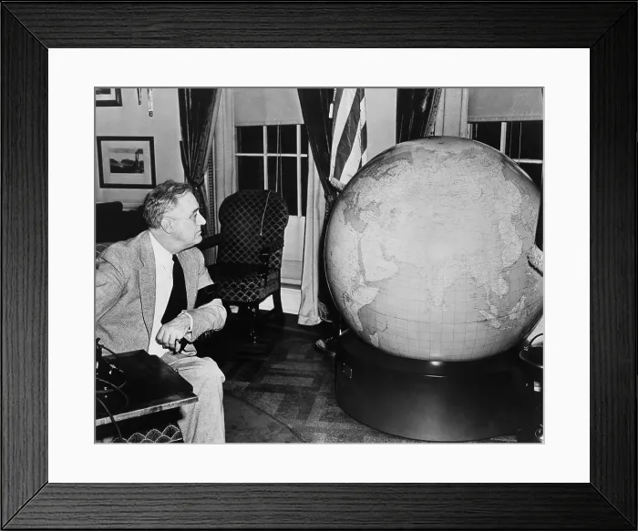Framed Print : Franklin Roosevelt examines a globe presented to him by the U.S. Army. Dec. 25, 1925. (BSLOC_2013_5_161)