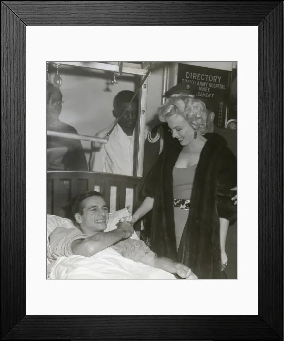 Framed Print : Marilyn Monroe visiting a wounded soldier in a hospital in Japan. Ca. Feb. 18-22, 1954. (BSLOC_2014_13_205)