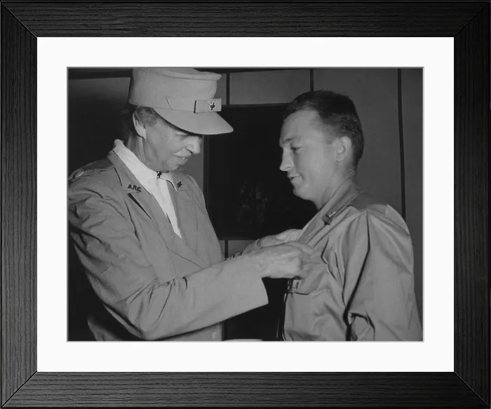 Framed Print : Eleanor Roosevelt pins a medal on a soldier in New Caledonia. Sept. 15, 1943 Framed Print : Eleanor Roosevelt pins a medal on a soldier in New Caledonia. Sept. 15, 1943