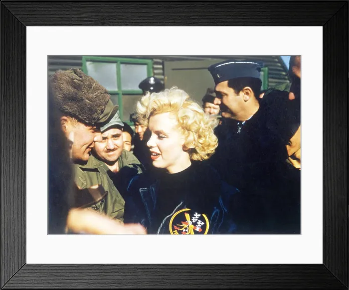 Framed Print : Marilyn Monroe wearing a jacket with the mosquito patch of the 6147th Tactical Control Group. Ca. Feb. 18-22, 1954. (BSLOC_2014_13_209)