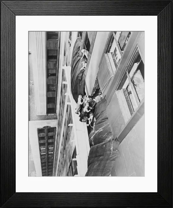 Framed Print : Workmen place a canvas over the hole between 78th and 79th floors of the Empire State Building. A B-25 Mitchell bomber crashed into the building during thick fog on July 28, 1945 Framed Print : Workmen place a canvas over the hole between 78th and 79th floors of the Empire State Building. A B-25 Mitchell bomber crashed into the building during thick fog on July 28, 1945