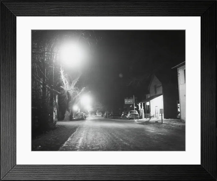 Framed Print : Night scene in a newly electrified town somewhere in rural American. Ca. 1940