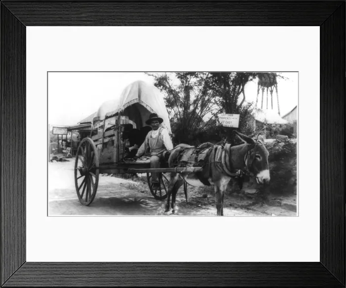 Framed Print : Mexican man on a donkey cart emigrating to the United States via Nuevo Laredo, directly across the Rio Grande River from Laredo, Texas. Ca. 1912