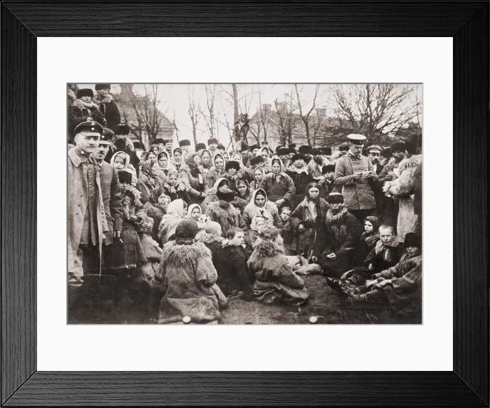 Framed Print : Crowd of Eastern European emigrants, possibly Jewish, with three Russian officials, who are reviewing their travel papers. ca. 1912